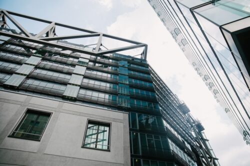 BERLIN, GERMANY - JUNE 20, 2017: low angle view of modern skyscrapers and blue sky, Potsdamer Platz,